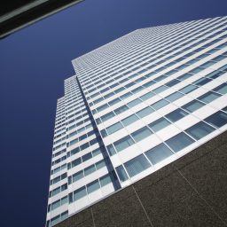 Picture of a tall office block taken from the ground