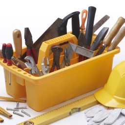 Toolbox, hard hat and spirit level