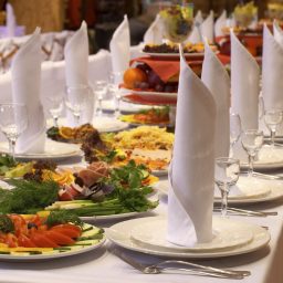 A large table set for a formal, celebratory meal